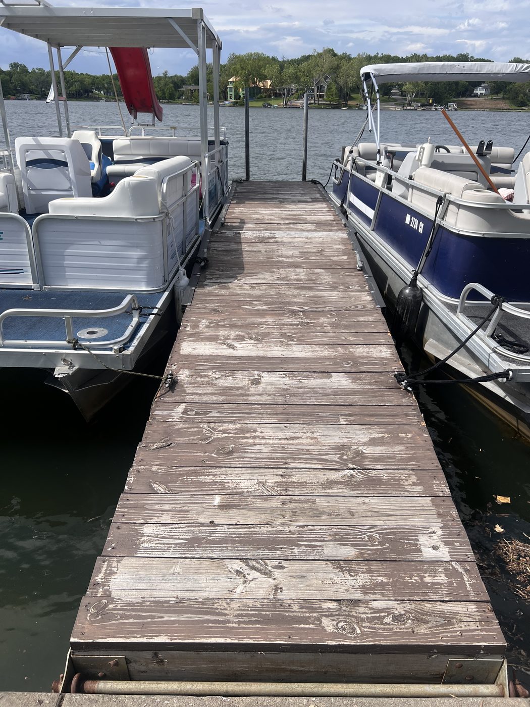 Same dock freshly stained a rich brown color after work was complete