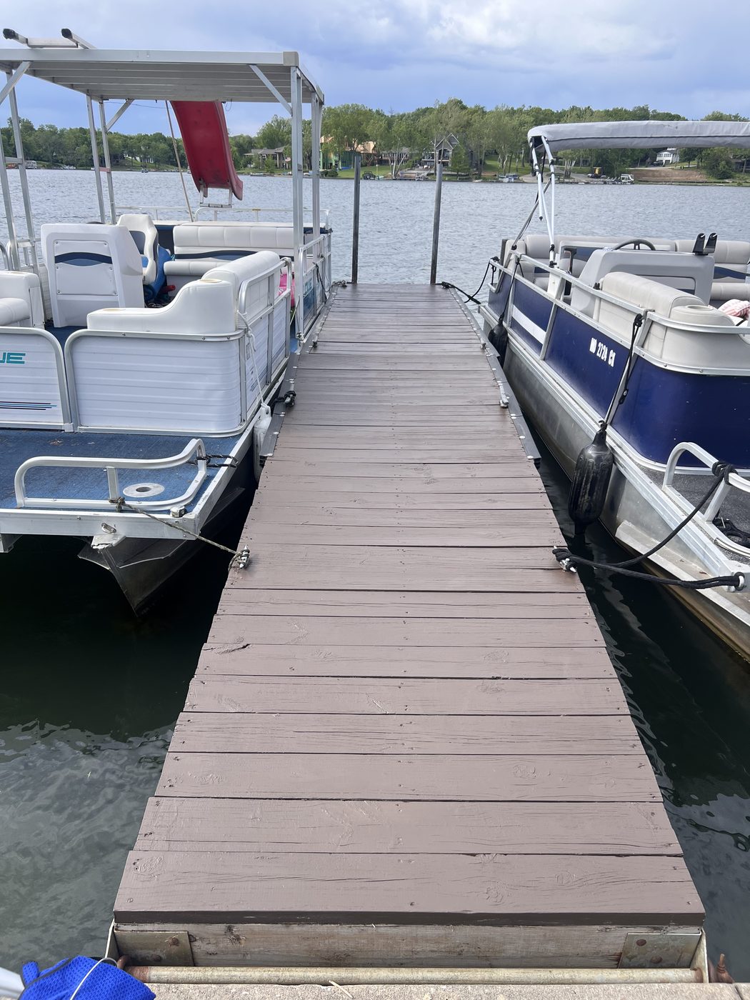 Weathered, sun-bleached dock on Weatherby Lake before staining